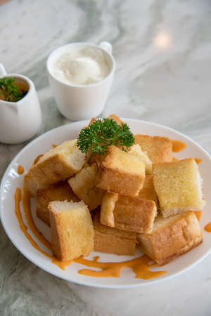 Dessert afternoon tea is a Thai tea sauce with small toast  and ice creamの写真素材