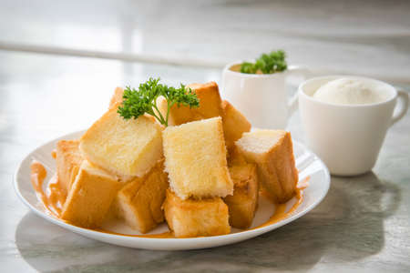 Dessert afternoon tea is a Thai tea sauce with small toast  and ice creamの写真素材