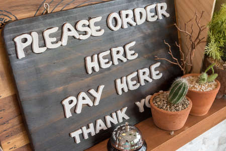 wooden sign in cafeteria for customer.の写真素材