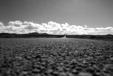 An empty road leads far to the horizon の写真素材