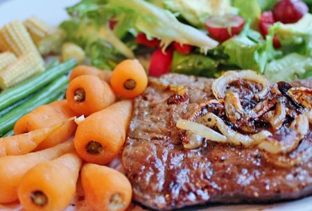 bbq steak vegetables and saladの写真素材