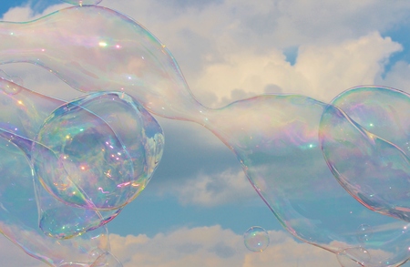 Soap Bubbles on the breeze in the skyの写真素材
