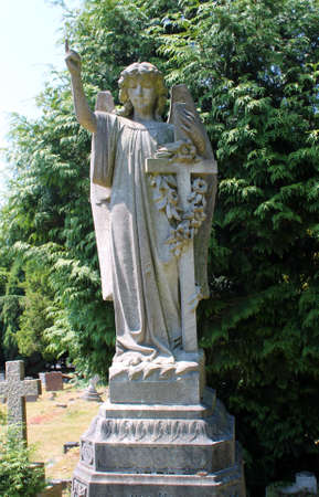 Tombstone and graves in an ancient church graveyard 