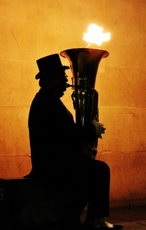 sillouhette of tuba with flames coming outの写真素材