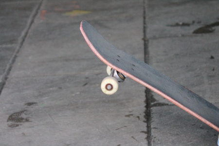 lone skateboard in skate park  - Stock Photo