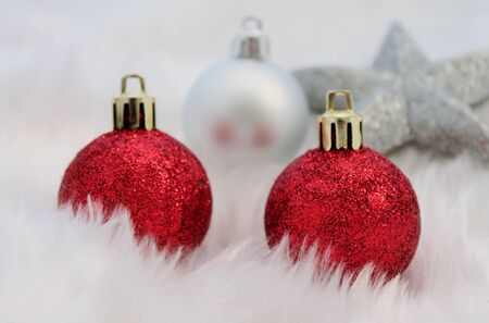 Red silver christmas decoration with fake snow made of white furの写真素材