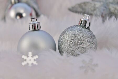 silver christmas decoration with fake snow made of white furの写真素材