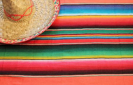 Traditional Mexican fiesta poncho rug  in bright colors with sombrero の写真素材