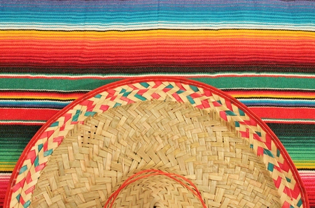 Traditional Mexican fiesta poncho rug  in bright colors with sombrero の写真素材
