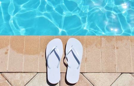 Poolside holiday vacation scenic swimming pool summer sandels shoesの写真素材