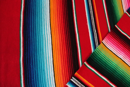 Mexico traditional cinco de mayo rug poncho fiesta background with stripes copy spaceの写真素材
