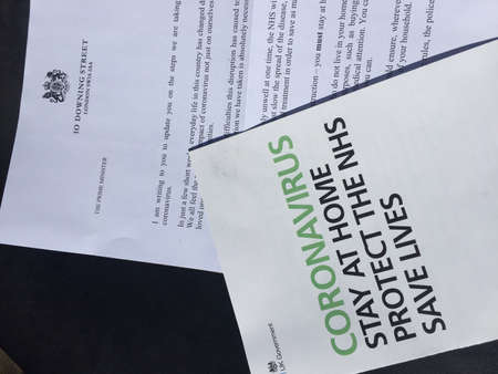 London, Uk - 08/04/2020: Coronavirus covid-19 Boris Johnson Prime minister letter sent to households UK with advise regarding pandemic guidelines and information: social distancing and isolationのeditorial素材