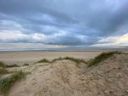 Camber sands beach, Rye, East Sussex UK, Camber is a flat sandy beach with giant sand dunes South coast England and popular with tourists and daytrippers in  only sand dune system in East Sussex, Ukのeditorial素材