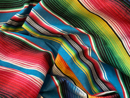 Mexican colorful striped sombrero fabric as background, top viewの写真素材