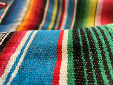 Detail of a colorful hand woven cotton fabric in a close up viewの写真素材