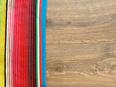 Colorful cloth on wooden table, top view. Space for textの写真素材