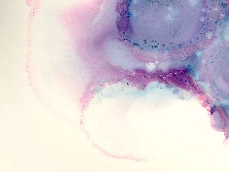 Abstract background of pink and blue watercolor paint splashing on paperの写真素材