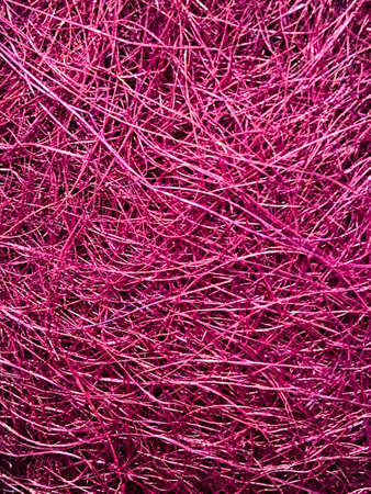 Close up of a pile of pink threads for use as a background.の写真素材