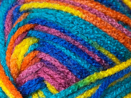 Colorful wool yarn close-up macro photo. Multicolored wool backgroundの写真素材