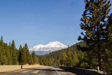 Mount Shasta, California, stands majestic in the distance. A lone cloud covers its face.の写真素材