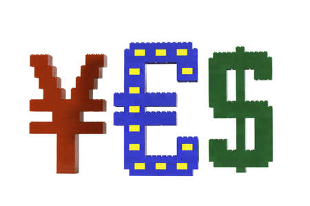 Currency symbols constructed from toy bricks and shot against a white background at an angle to show...