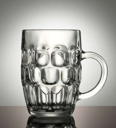 empty beer glass on a white backgroundの写真素材