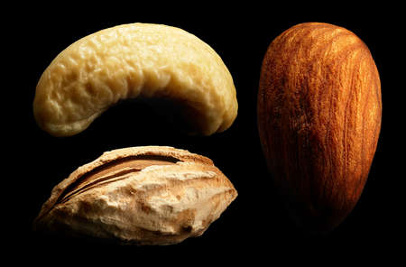 Group of nuts on black background. Close-up or macro. Health concept