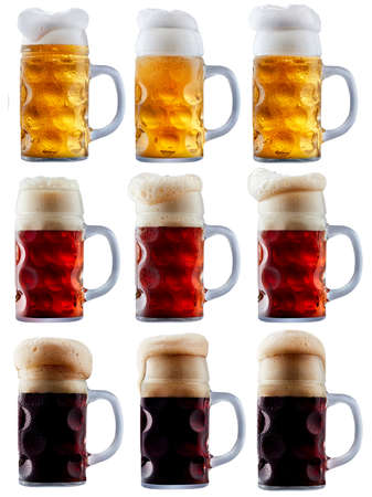 Mug collection of frosty dark red and light beer with foam isolated on a white backgroundの写真素材