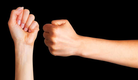 Set of woman clenched fist. Concept of unity, fight and cooperation on black background. Isolated with clipping path.の写真素材