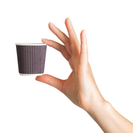 Woman hand holding coffee paper drinking cup with disposable top cap on whiteの写真素材