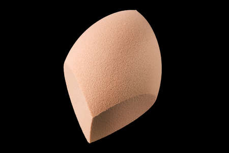Makeup tool sponge or beauty blender isolated on blackの写真素材