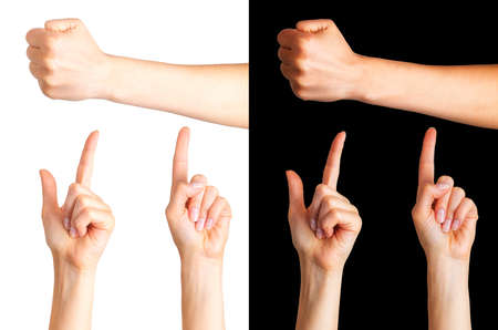 Set of woman hands with the index finger pointing up and fist on black and whiteの写真素材
