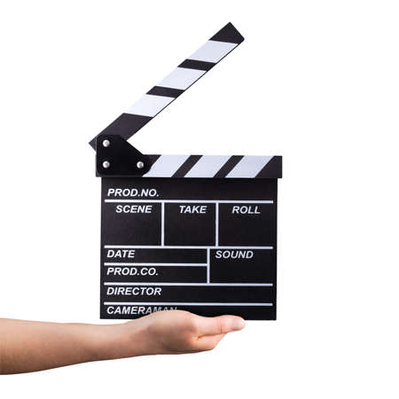 Human hand holding film clapper board isolated on whiteの写真素材