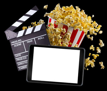 Flying popcorn, film clapper board and phone isolated on black background, concept of watching TV or...