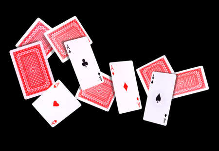 Flying playing cards for poker game on black background. Concept of gamble games and casino