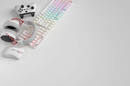 Top view of gamer workspace and gear like mouse, keyboard, joystick, headset on white table...