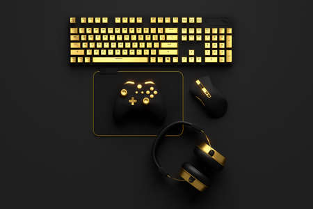 Top view of gamer workspace and gold gear like mouse, keyboard, joystick, headset on black table...