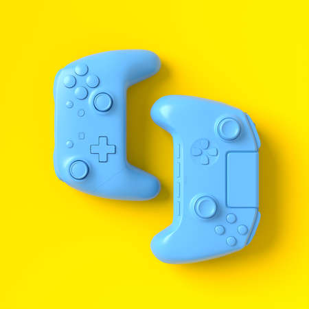 Set of lying gamer joysticks or gamepads on yellow background