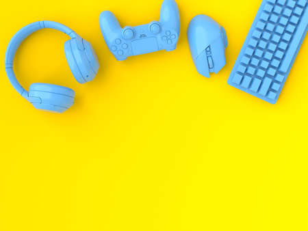 Top view of gamer gears like mouse, keyboard, joystick and headphones on yellow