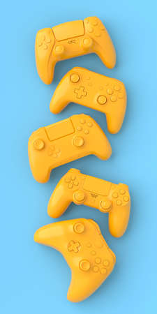 Set of lying gamer joysticks or gamepads on blue and yellow backgroundの写真素材