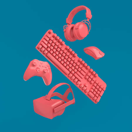 Flying gamer gears like VR glasses, headphones and joystick on blue and pinkの写真素材