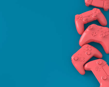 Set of lying gamer joysticks or gamepads on blue and pink background