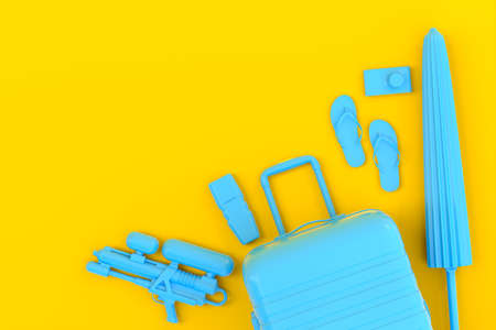 Colorful suitcase or baggage with beach accessories like flip flops, water gun, sunscreen and...