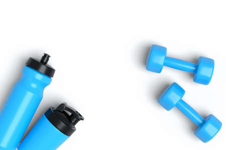 Isometric view of sport equipment like water bottle and dumbbell on whiteの写真素材