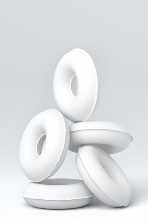 Colorful inflatable ring on monochrome white background. 3D render of summer vacation concept and holidaysの写真素材