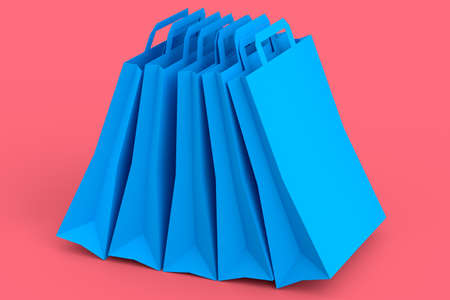 Set of kraft paper bag with handle isolated on pink background.