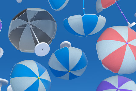 Many of flying striped beach umbrella for lounge zone on seashore isolated on blue background. 3d render of summer vacation concept and holidays travel concept with luggageの写真素材