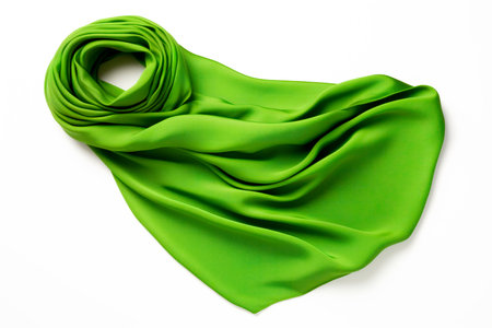 Green silk scarf levitating and isolated on white background. Winter warm scarf.の素材