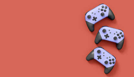 Realistic grey video game joysticks or gamepads on red background