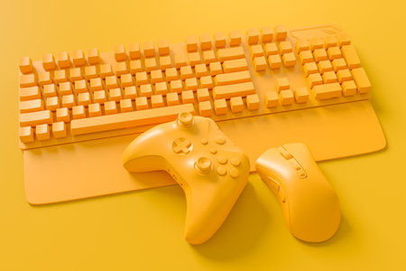 Neatly organized home office setup with tech gadgets like a wireless keyboard, gaming controllers, and mouse on monochrome backgroundの写真素材
